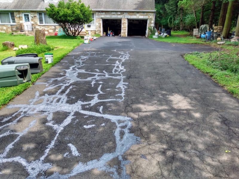 Filled and unfilled driveway cracks