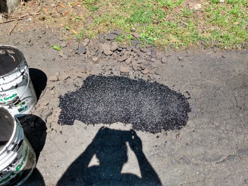 Filled pothole in an Asphalt Driveway