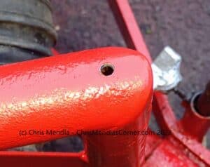 Hole drilled in the top of the intake hose arm to allow for the injection of penetrating oil